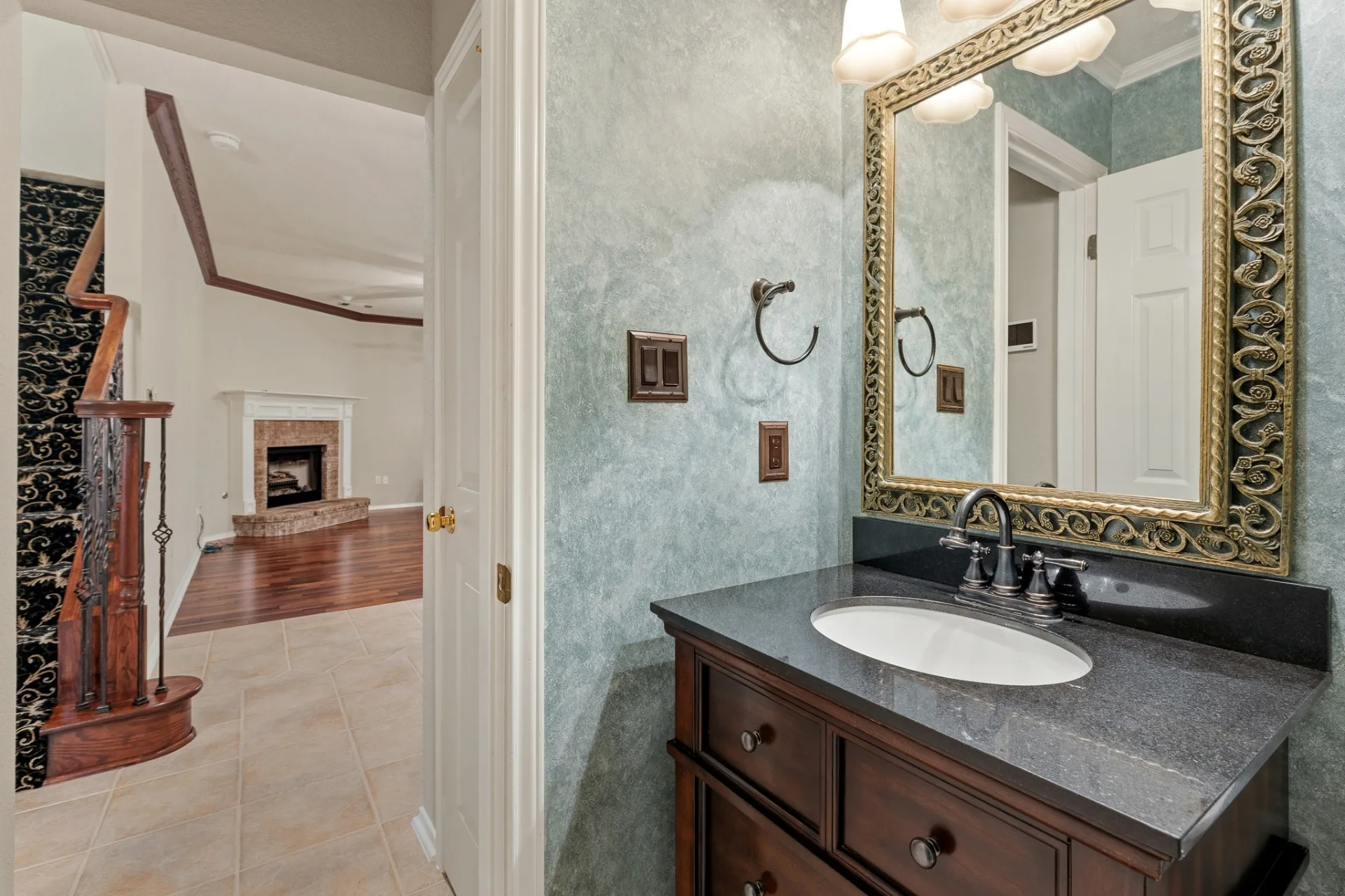Powder bath with view to family room and fireplace