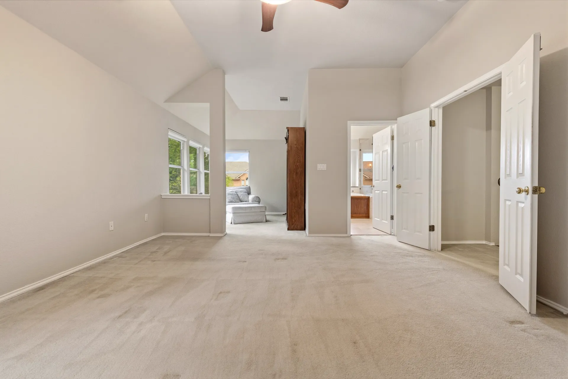 Primary bedroom entry with double doors and ensuite access