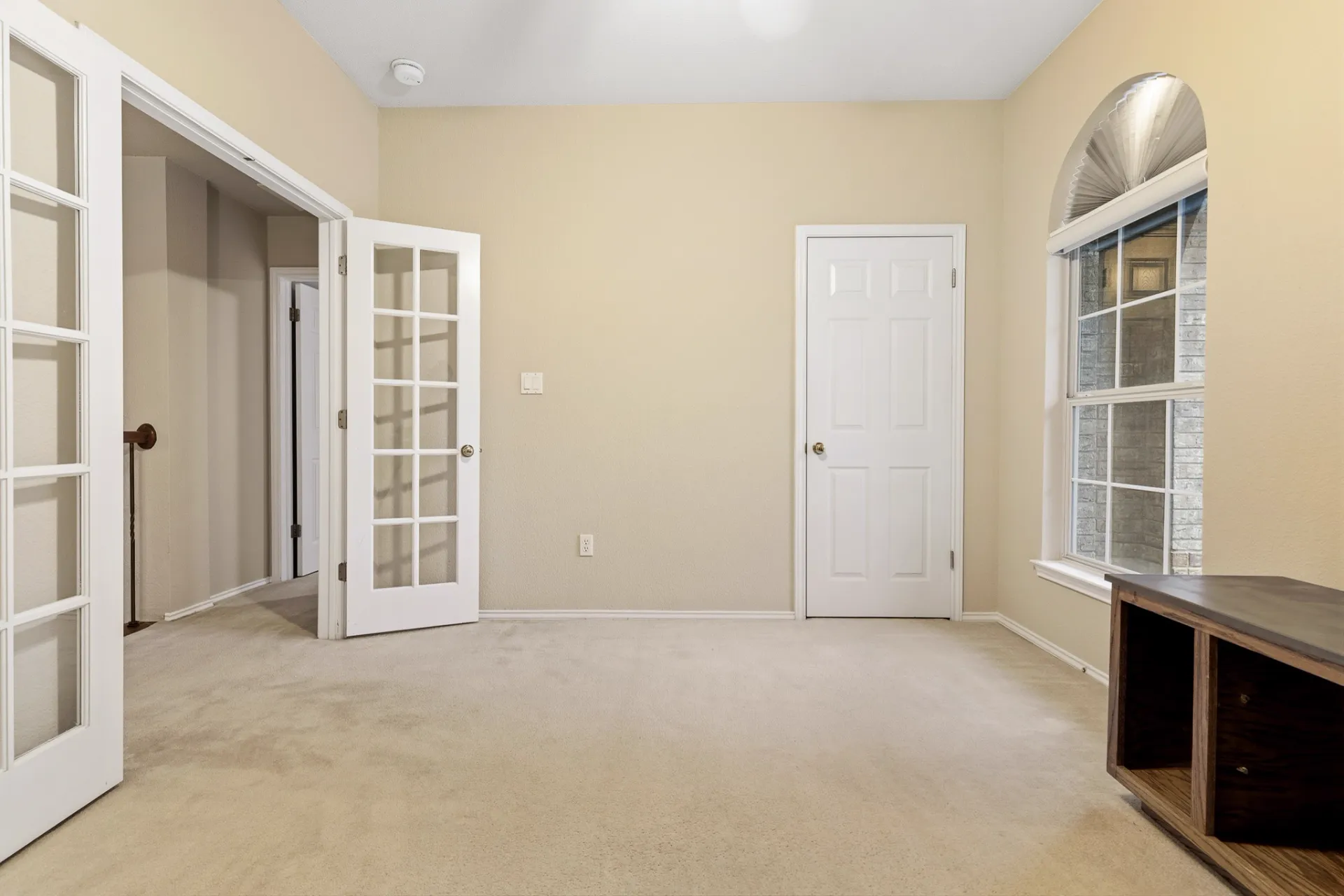 Downstairs office with French doors and arched window