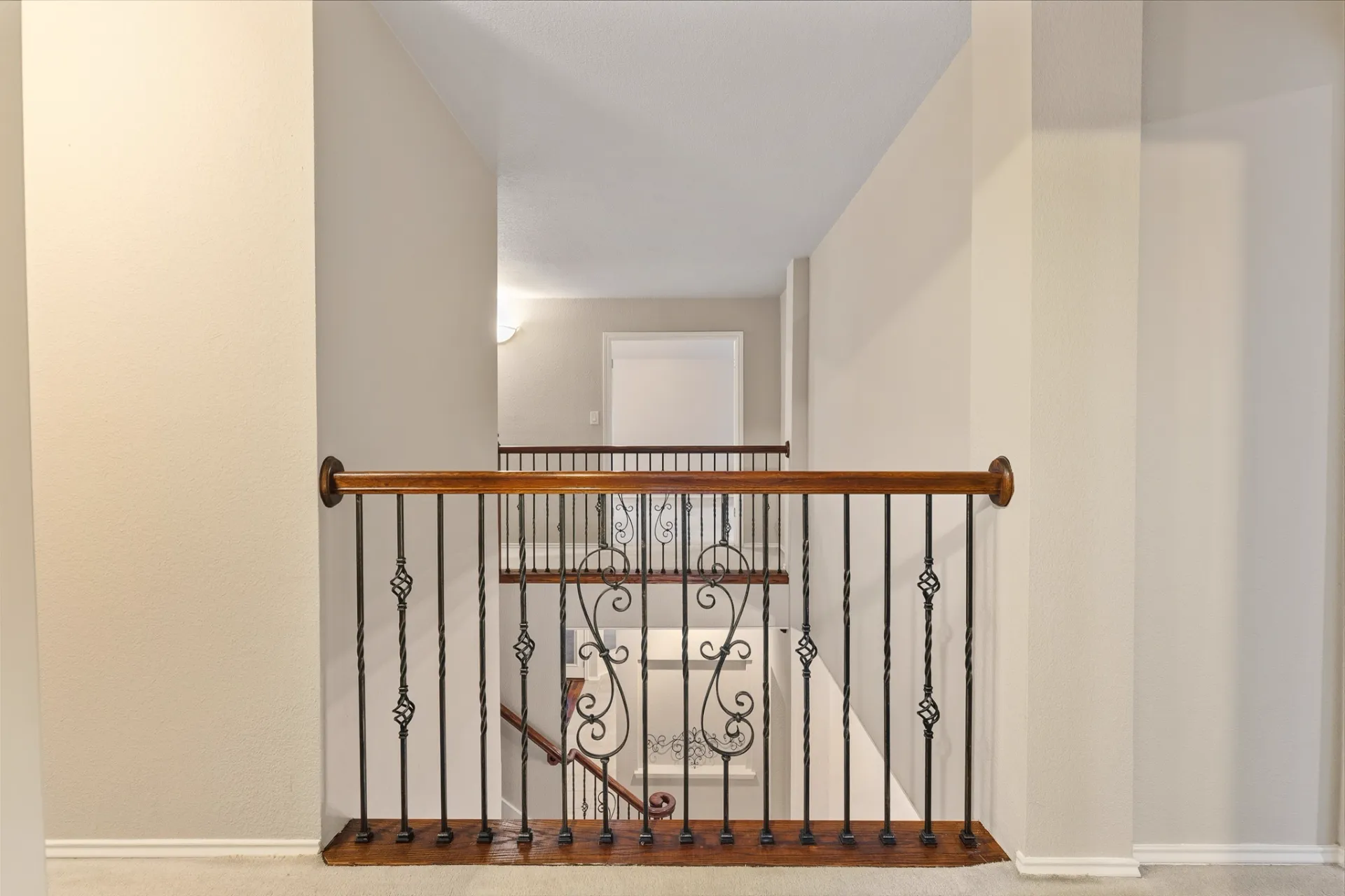 Upstairs landing rail looking down to the foyer staircase